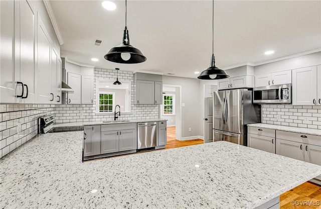 11517 Mount Hermon Rd, Ashland, VA 23005 - kitchen featuring appliances with stainless steel finishes, a sink, tasteful backsplash, a peninsula, and light stone counters