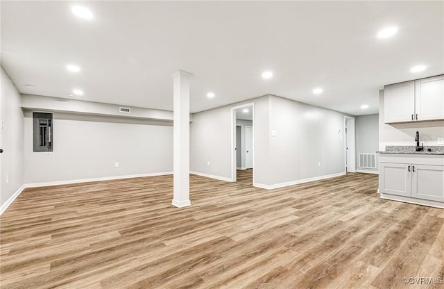 11517 Mount Hermon Rd, Ashland, VA 23005 - finished basement featuring light wood finished floors, wet bar, recessed lighting, baseboards, and electric panel
