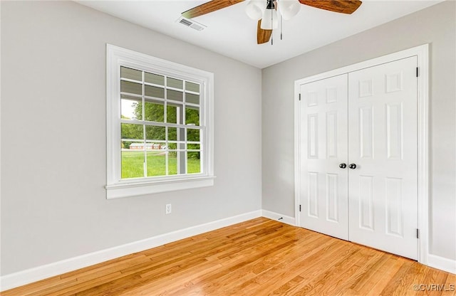 11517 Mount Hermon Rd, Ashland, VA 23005 - unfurnished bedroom with baseboards, light wood-type flooring, a closet, and a ceiling fan