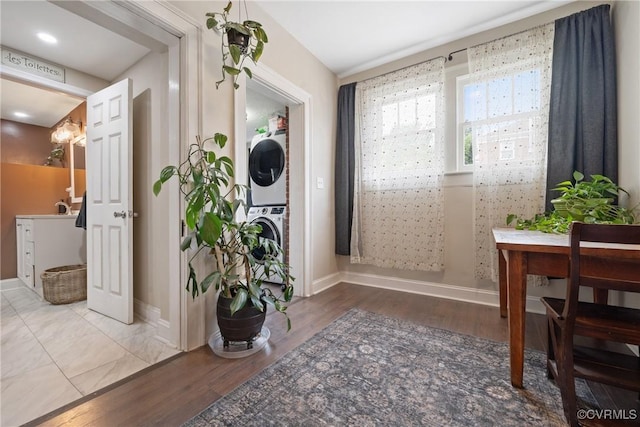 1942 Berkeley Ave, Petersburg, VA 23805 - entrance foyer featuring estacked washer and dryer, wood finished floors, and baseboards