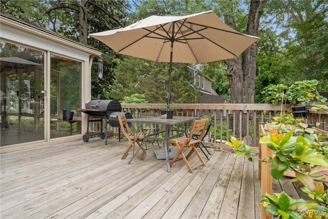1942 Berkeley Ave, Petersburg, VA 23805 - wooden deck featuring outdoor dining space, a sunroom, and a grill