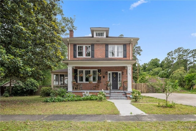 1942 Berkeley Ave, Petersburg, VA 23805 - traditional style home featuring brick siding, a porch, and a chimney