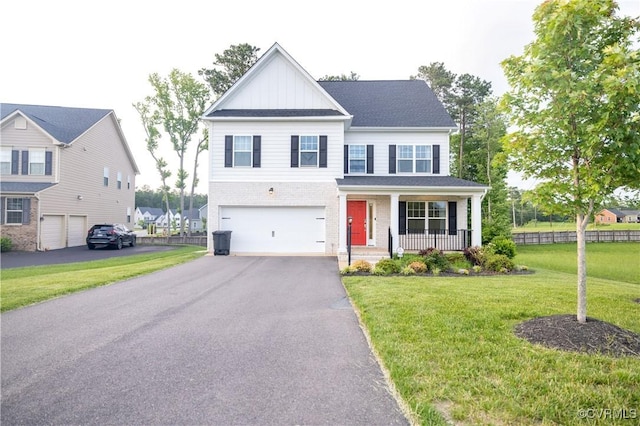 12194 Elnora Ln, Glen Allen, VA 23059 - view of front facade with an attached garage, covered porch, board and batten siding, asphalt driveway, and brick siding