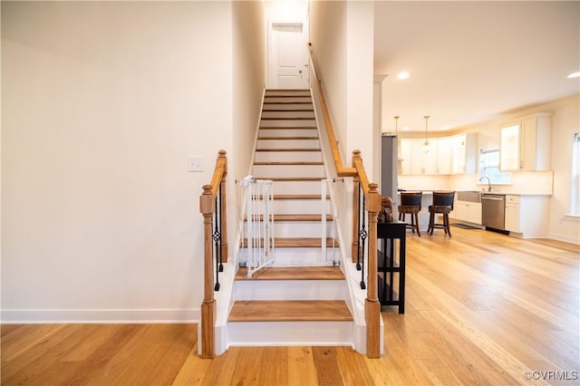 12194 Elnora Ln, Glen Allen, VA 23059 - stairway featuring wood finished floors, baseboards, and recessed lighting