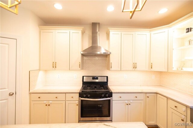 12194 Elnora Ln, Glen Allen, VA 23059 - kitchen with wall chimney range hood, stainless steel range with gas stovetop, tasteful backsplash, light countertops, and recessed lighting