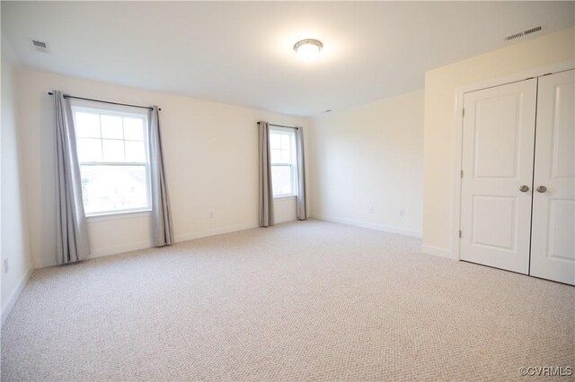 12194 Elnora Ln, Glen Allen, VA 23059 - unfurnished bedroom featuring light carpet, a closet, and baseboards