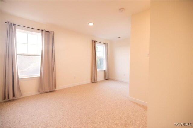 12194 Elnora Ln, Glen Allen, VA 23059 - spare room featuring light carpet, baseboards, and recessed lighting