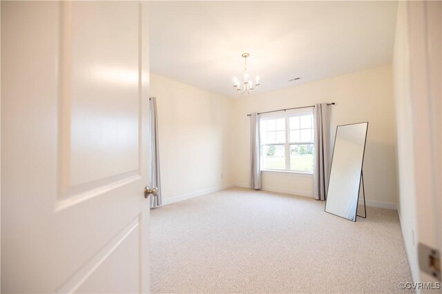 12194 Elnora Ln, Glen Allen, VA 23059 - unfurnished room featuring light colored carpet, a chandelier, and baseboards
