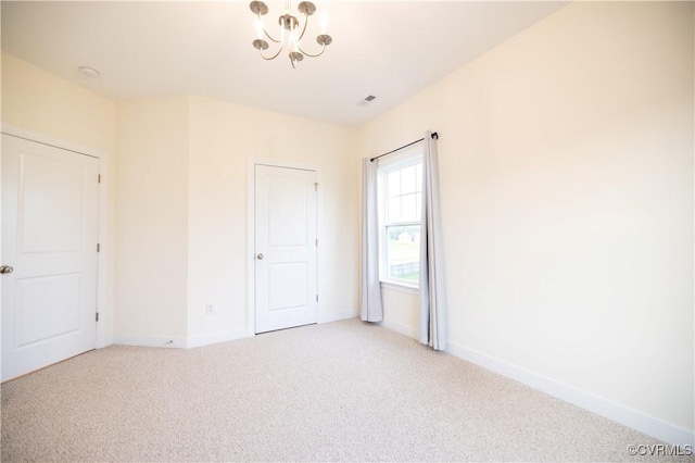12194 Elnora Ln, Glen Allen, VA 23059 - unfurnished bedroom featuring a chandelier, light colored carpet, and baseboards