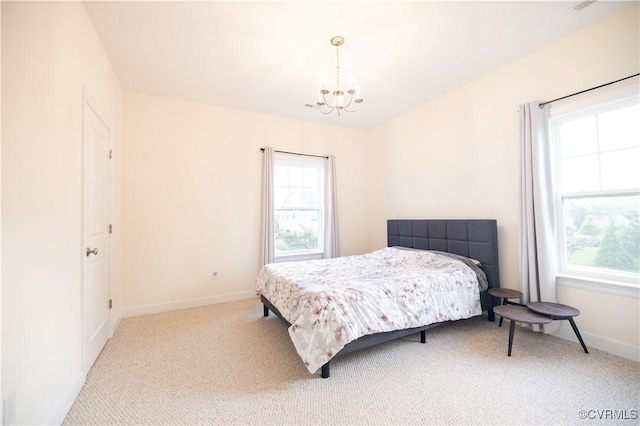 12194 Elnora Ln, Glen Allen, VA 23059 - carpeted bedroom featuring a chandelier and baseboards