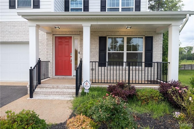 12194 Elnora Ln, Glen Allen, VA 23059 - view of exterior entry with brick siding and covered porch