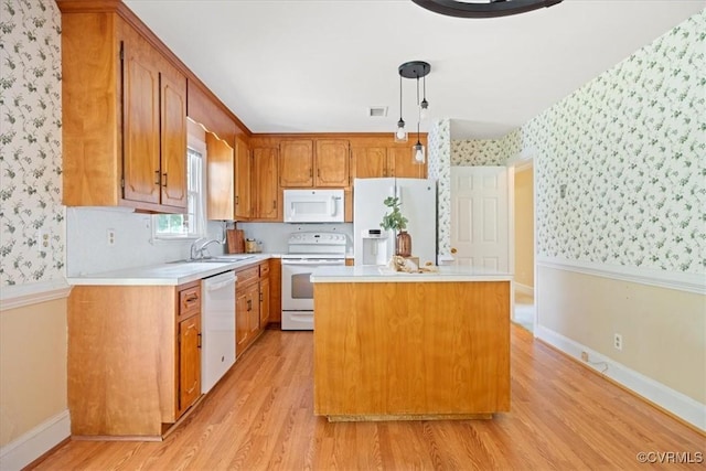 2861 Three Bridge Rd, Powhatan, VA 23139 - kitchen featuring white appliances, wallpapered walls, light wood finished floors, light countertops, and a kitchen island