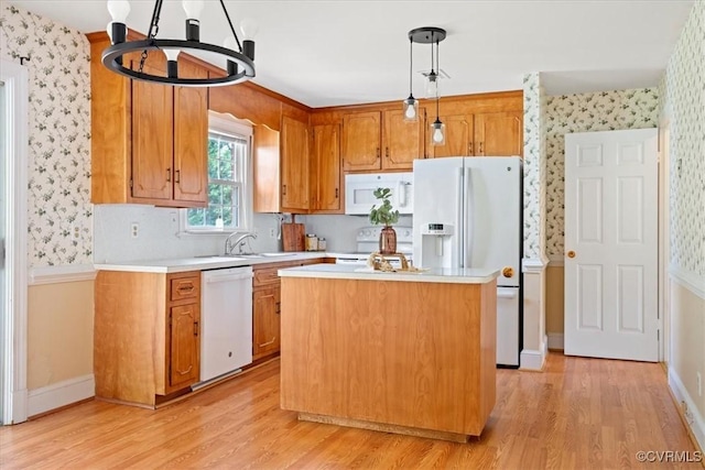 2861 Three Bridge Rd, Powhatan, VA 23139 - kitchen featuring white appliances, wallpapered walls, light countertops, light wood finished floors, and brown cabinets