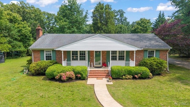 2861 Three Bridge Rd, Powhatan, VA 23139 - bungalow-style house with a porch, brick siding, a front lawn, and a chimney