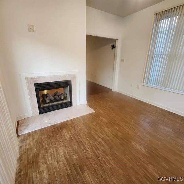 7408 First Landing Ct, Henrico, VA 23231 - unfurnished living room featuring wood finished floors and a tiled fireplace