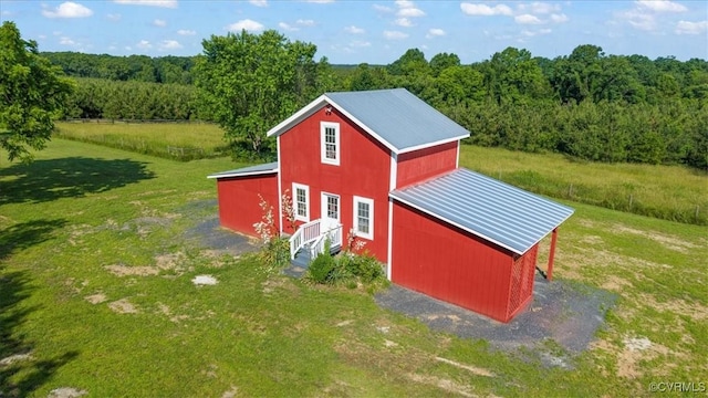 24405 N James Madison Hwy, New Canton, VA 23123 - view of pole building with a forest view and a lawn
