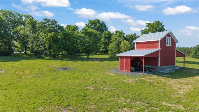 24405 N James Madison Hwy, New Canton, VA 23123 - view of green lawn with an outbuilding and view of wooded area