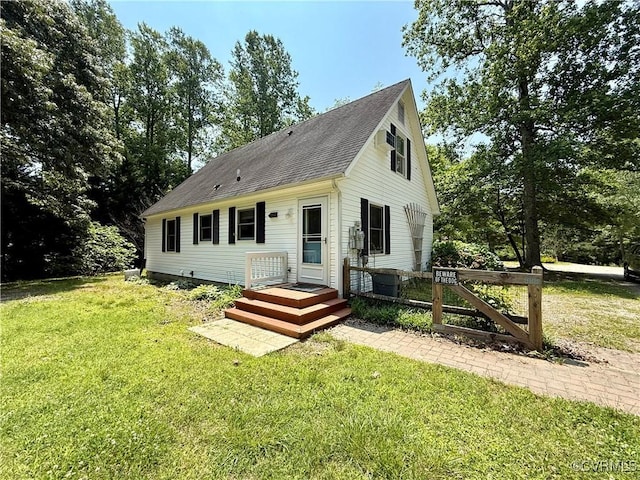 241 Levelfield Ln, Lancaster, VA 22503 - view of front facade with a front yard and a shingled roof