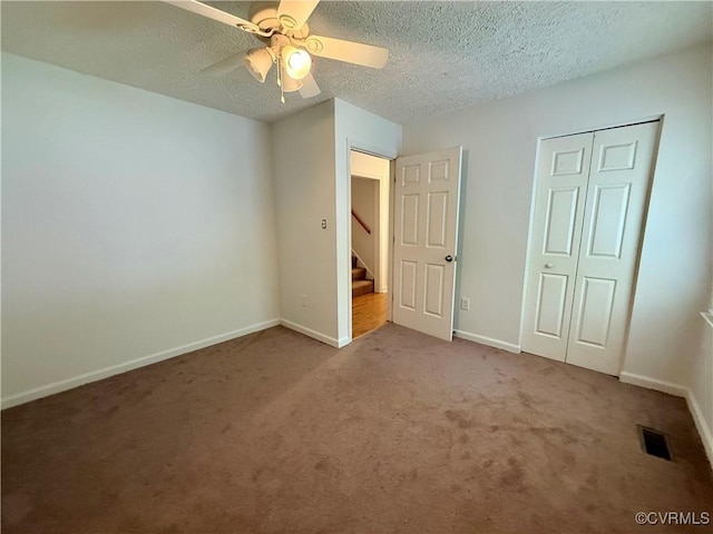 241 Levelfield Ln, Lancaster, VA 22503 - unfurnished bedroom featuring carpet flooring, a textured ceiling, baseboards, ceiling fan, and a closet