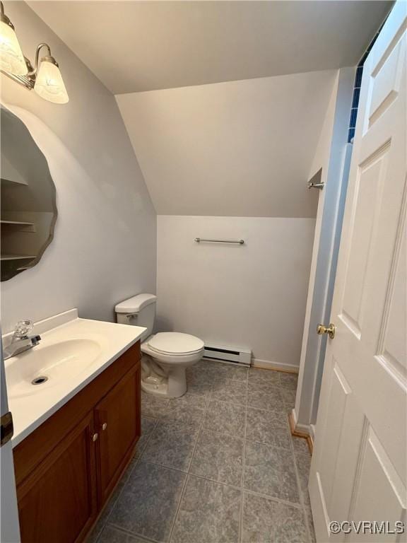 241 Levelfield Ln, Lancaster, VA 22503 - bathroom featuring a baseboard radiator, vanity, vaulted ceiling, and toilet