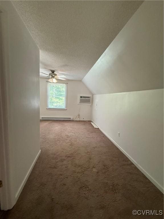 241 Levelfield Ln, Lancaster, VA 22503 - additional living space with baseboard heating, baseboards, carpet floors, vaulted ceiling, and an AC wall unit