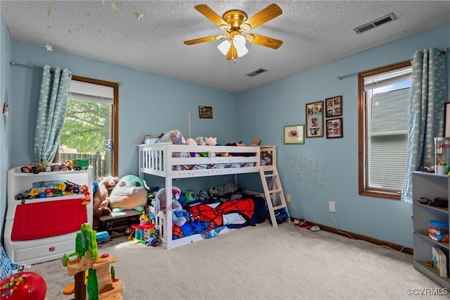 106 S Marion Ave Unit A, Hopewell, VA 23860 - carpeted bedroom featuring a textured ceiling and ceiling fan