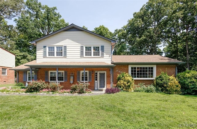 7436 Kirkwall Dr, North Chesterfield, VA 23235 - view of front facade with brick siding, a front yard, a porch, and a shingled roof