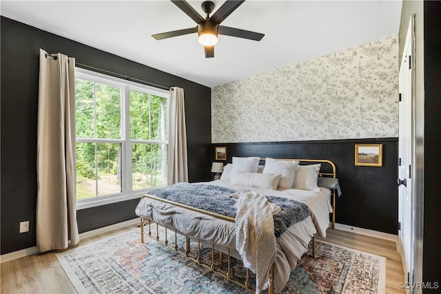 2401 Willowvale Pl, Midlothian, VA 23112 - bedroom with light wood finished floors, wallpapered walls, baseboards, and a ceiling fan