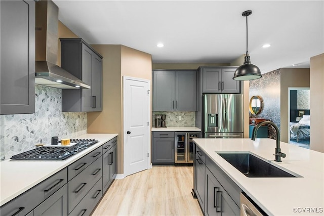 2401 Willowvale Pl, Midlothian, VA 23112 - kitchen featuring stainless steel appliances, wall chimney exhaust hood, a sink, beverage cooler, and light countertops