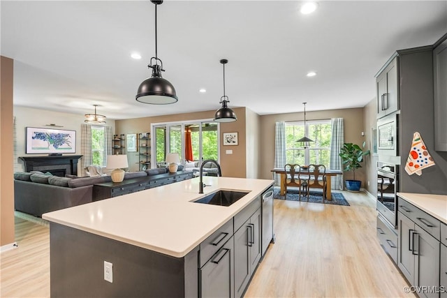 2401 Willowvale Pl, Midlothian, VA 23112 - kitchen with a sink, appliances with stainless steel finishes, light wood-type flooring, light countertops, and recessed lighting
