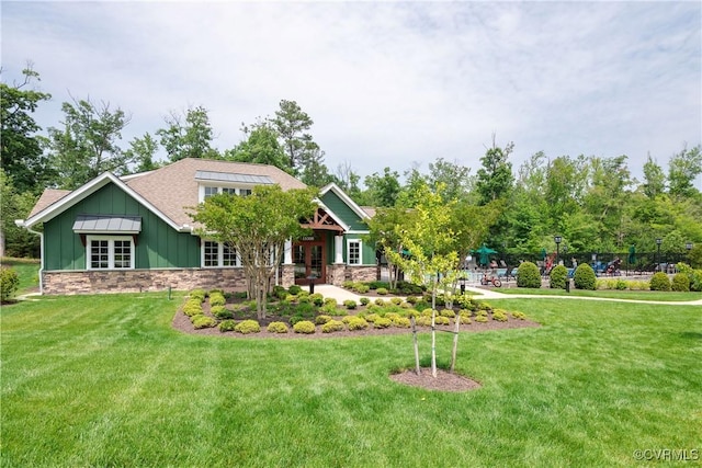 2401 Willowvale Pl, Midlothian, VA 23112 - craftsman-style home with stone siding, a front yard, board and batten siding, and french doors
