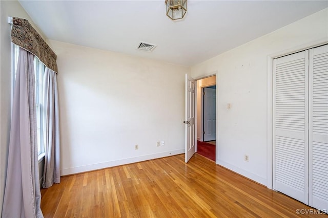 10108 Waltham Dr, Henrico, VA 23238 - unfurnished bedroom featuring light wood-style floors and a closet