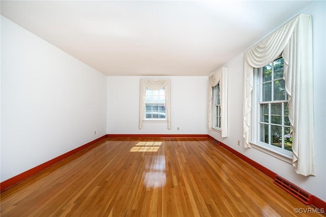 10108 Waltham Dr, Henrico, VA 23238 - empty room with healthy amount of natural light and light wood-style floors