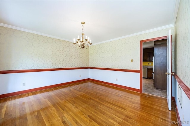 10108 Waltham Dr, Henrico, VA 23238 - unfurnished room with a chandelier, wood finished floors, ornamental molding, and wallpapered walls