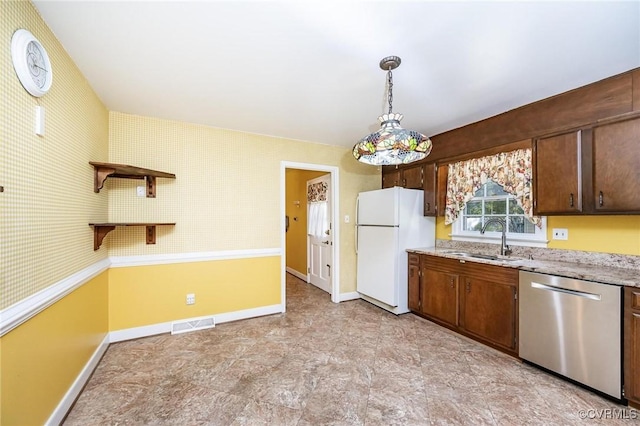 10108 Waltham Dr, Henrico, VA 23238 - kitchen featuring stainless steel dishwasher, freestanding refrigerator, pendant lighting, light stone countertops, and dark brown cabinetry