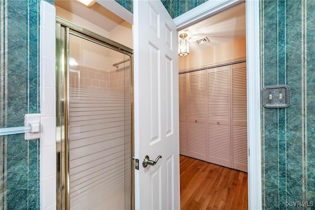 10108 Waltham Dr, Henrico, VA 23238 - full bath with wood finished floors, a shower stall, and a closet