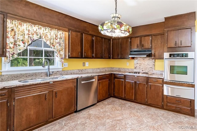 10108 Waltham Dr, Henrico, VA 23238 - kitchen featuring stainless steel appliances, a warming drawer, under cabinet range hood, decorative backsplash, and pendant lighting