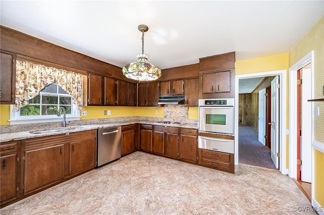 10108 Waltham Dr, Henrico, VA 23238 - kitchen with stainless steel appliances, a warming drawer, under cabinet range hood, light stone counters, and pendant lighting
