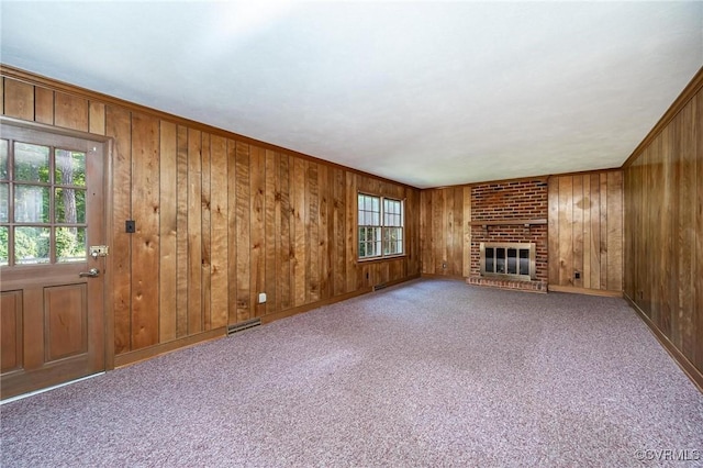 10108 Waltham Dr, Henrico, VA 23238 - unfurnished living room featuring wooden walls, plenty of natural light, a brick fireplace, and carpet floors