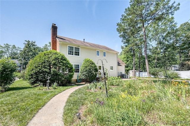 10108 Waltham Dr, Henrico, VA 23238 - back of property featuring a chimney and a lawn