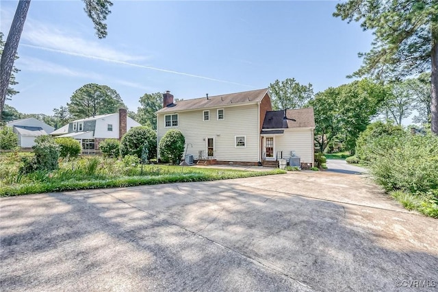 10108 Waltham Dr, Henrico, VA 23238 - back of property featuring driveway and a chimney