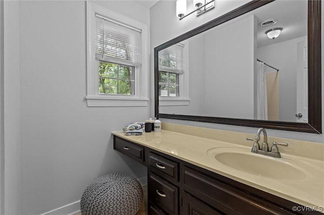 4709 Pompton Ln, Chester, VA 23831 - full bathroom featuring vanity, baseboards, and a shower with shower curtain