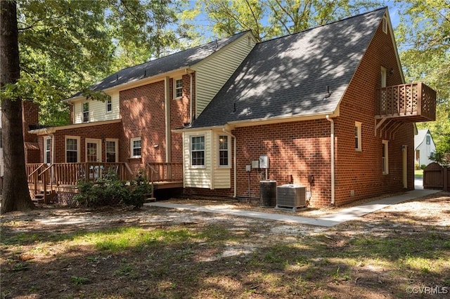 4709 Pompton Ln, Chester, VA 23831 - back of property featuring central air condition unit, brick siding, a wooden deck, and roof with shingles