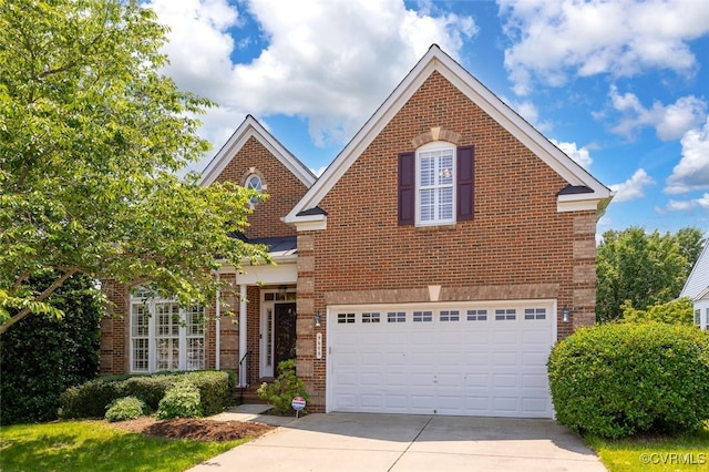 5606 E Kesslers Xing, Fredericksburg, VA 22407 - traditional home featuring brick siding, driveway, and an attached garage
