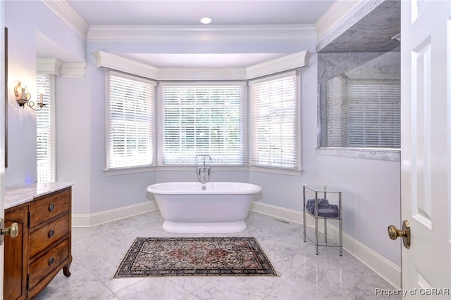 1921 Miln House Rd, Williamsburg, VA 23185 - full bathroom with a soaking tub, baseboards, ornamental molding, vanity, and marble finish flooring
