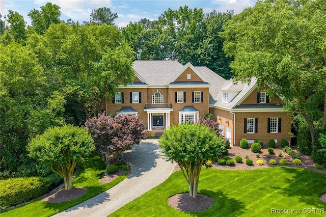 1921 Miln House Rd, Williamsburg, VA 23185 - colonial inspired home with a front lawn and an attached garage