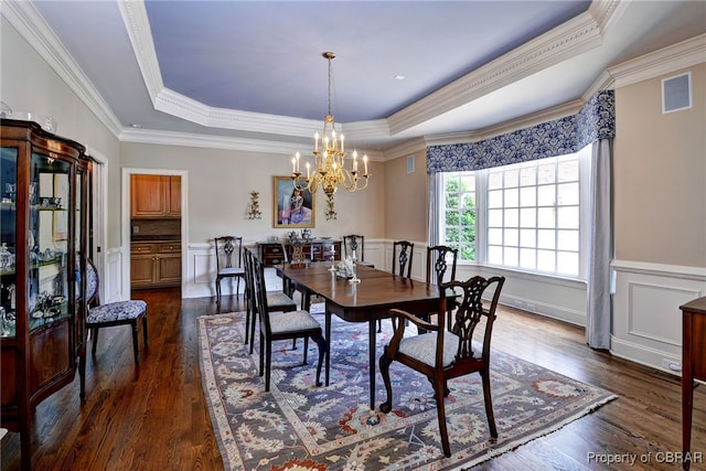 1921 Miln House Rd, Williamsburg, VA 23185 - dining room with a raised ceiling, a chandelier, dark wood-style flooring, and ornamental molding