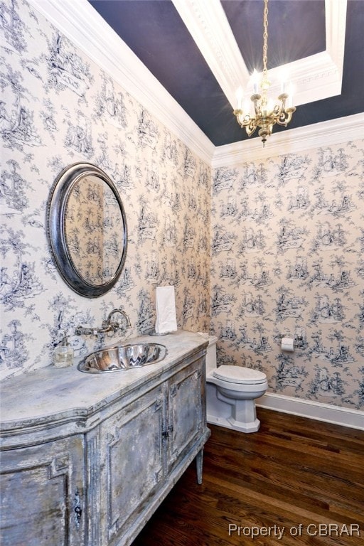 1921 Miln House Rd, Williamsburg, VA 23185 - half bath with wood finished floors, vanity, a chandelier, toilet, and wallpapered walls