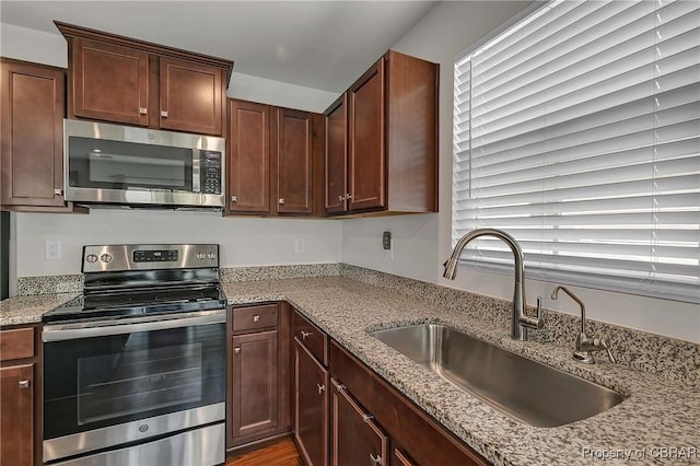 202 Arbordale Loop, Williamsburg, VA 23188 - kitchen featuring stainless steel appliances, a sink, and light stone countertops