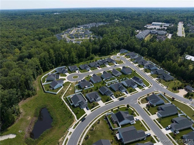 202 Arbordale Loop, Williamsburg, VA 23188 - aerial view of property's location featuring a heavily wooded area, a nearby body of water, and nearby suburban area